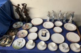 A pair of spelter figures together with clown figures, collectors plates and part tea sets,