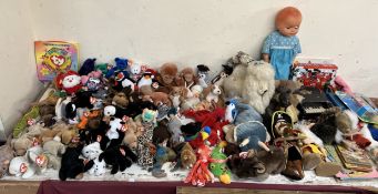 A collection of TY Beanie Babies together with other toys, books,