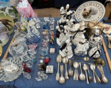 A collection of continental porcelain figures together with electroplated cutlery, glass animals,