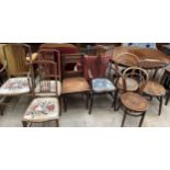 A set of three Edwardian mahogany salon chairs together with a hall chair, a stick back elbow chair,