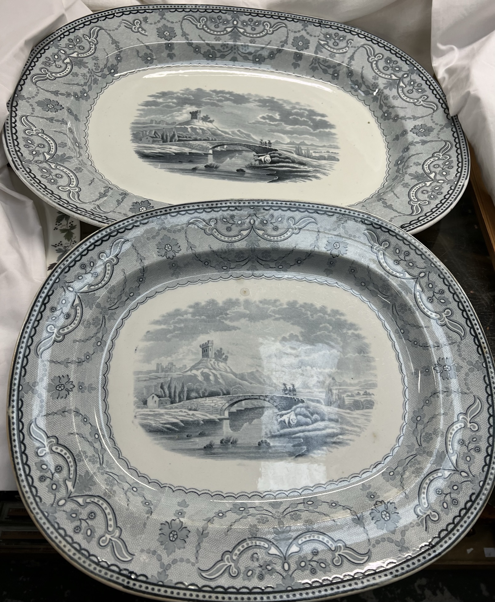 A graduated pair of Copeland blue and white meat plates decorated with a castle in a landscape