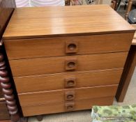A Uniflex teak chest with five drawers on cylindrical legs