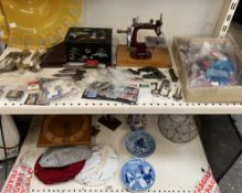 Assorted stamps together with a miniature sewing machine, jewellery box, feathers, clock,