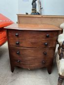A 19th century mahogany commode in the form of a chest of drawers with a hinged top on splayed
