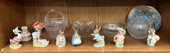 A Royal Crown Derby squirrel paperweight and Royal Albert Beatrix Potter figures,