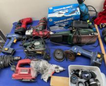 Assorted power tools including a planer, sander,