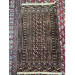 A red ground Turkoman rug with multiple guls and guard stripes,
