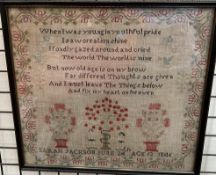 A 19th century sampler depicting Adam and Eve,