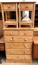 A pine chest of drawers 112cm high x 86cm wide x 44cm deep together with a pair of bedside cabinets,