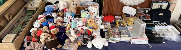 A collection of TY beanie babies together with knitting machine, bridge cards,