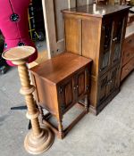 An oak hifi cabinet together with an oak side cabinet and a torchere with barley twist column