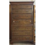 A George III mahogany chest on chest with a moulded dentil cornice above two short and three long