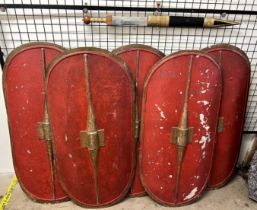 Television / Film props a set of five Roman shields of oval form painted red and a sword