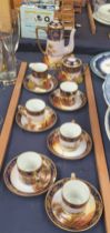 A Noritake part coffee service decorated with landscape scenes