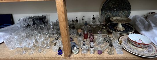 Assorted scent bottles together with dressing table trays, drinking glasses,