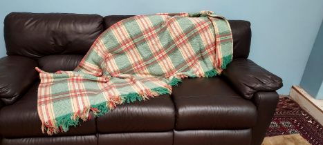 A Welsh blanket in green, red,