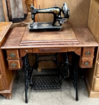 A singer sewing machine on a trestle table