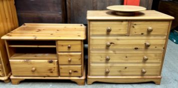 A pine chest of drawers together with a pine television cabinet and a lazy Susan