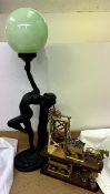 An Art Nouveau inspired table lamp in the form of a nude figure with flowing hair together with a