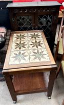 An oak side cabinet together with a tiled top tea trolley