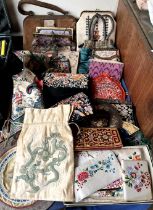 A collection of embroidered purses,