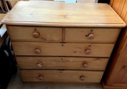 A pine chest with two short and three long drawers 90cm high x 105cm wide x 51cm deep
