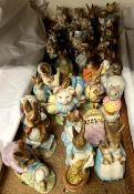 A collection of Beswick Beatrix pottery figures including Mr Benjamin Bunny & Peter Rabbit,