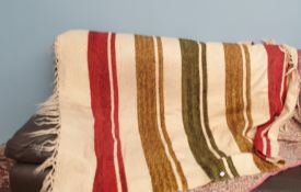 A striped wool throw/Welsh blanket with a cream ground and red,
