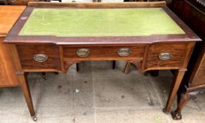 A 20th century mahogany desk with a leather inset and three drawers on square tapering legs