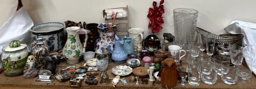 A collection of copper lustre jugs, other jugs, glass wares, paperweights,