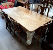 A pine kitchen refectory table together with four assorted chairs