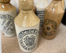 A collection of stoneware Ginger Beer bottles together with other bottles etc