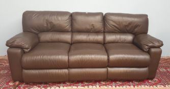 A brown leather three piece suite,