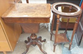 A Victorian burr walnut sewing table with a rectangular hinged top above a central well on four