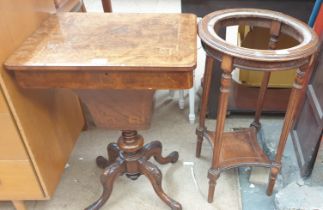 A Victorian burr walnut sewing table with a rectangular hinged top above a central well on four