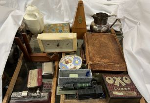 A metronome, teak book rest from SMS Birmingham, together with tins, barometer,