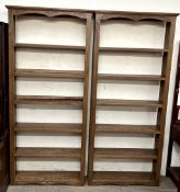 A pair of modern bookcases with plinth bases