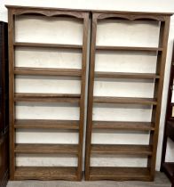 A pair of modern bookcases with plinth bases