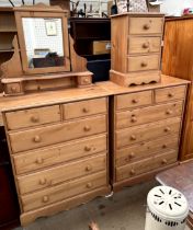 A pine dressing chest, with an easel mirror above two short and four long drawers,