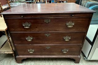 A 19th century mahogany bachelors chest with a rectangular top above a brushing slide and four long