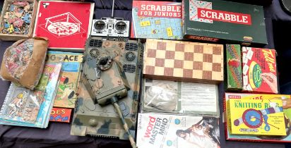 Assorted board games including Scrabble, dominoes, knitting ring, Mastermind,