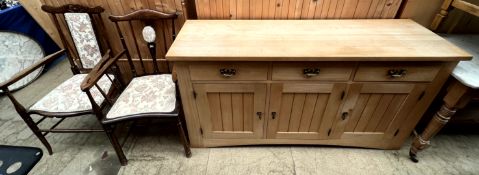 A modern oak sideboard together with two Edwardian elbow chairs