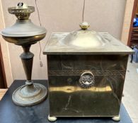 A brass oil lamp together with a brass coal box