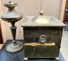 A brass oil lamp together with a brass coal box