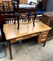 A 20th century oak Abbess D510 desk with a frieze drawer and three other drawers on square legs