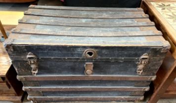 A trunk of rectangular form with metal mounts