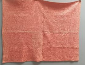 Two whole cloth Welsh quilts in pinks,