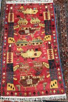 An Afghan War rug with a red ground decorated with tanks, helicopters and arrows,