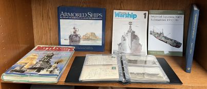 An album of postcards of warships and submarines together with books on ships and shipping