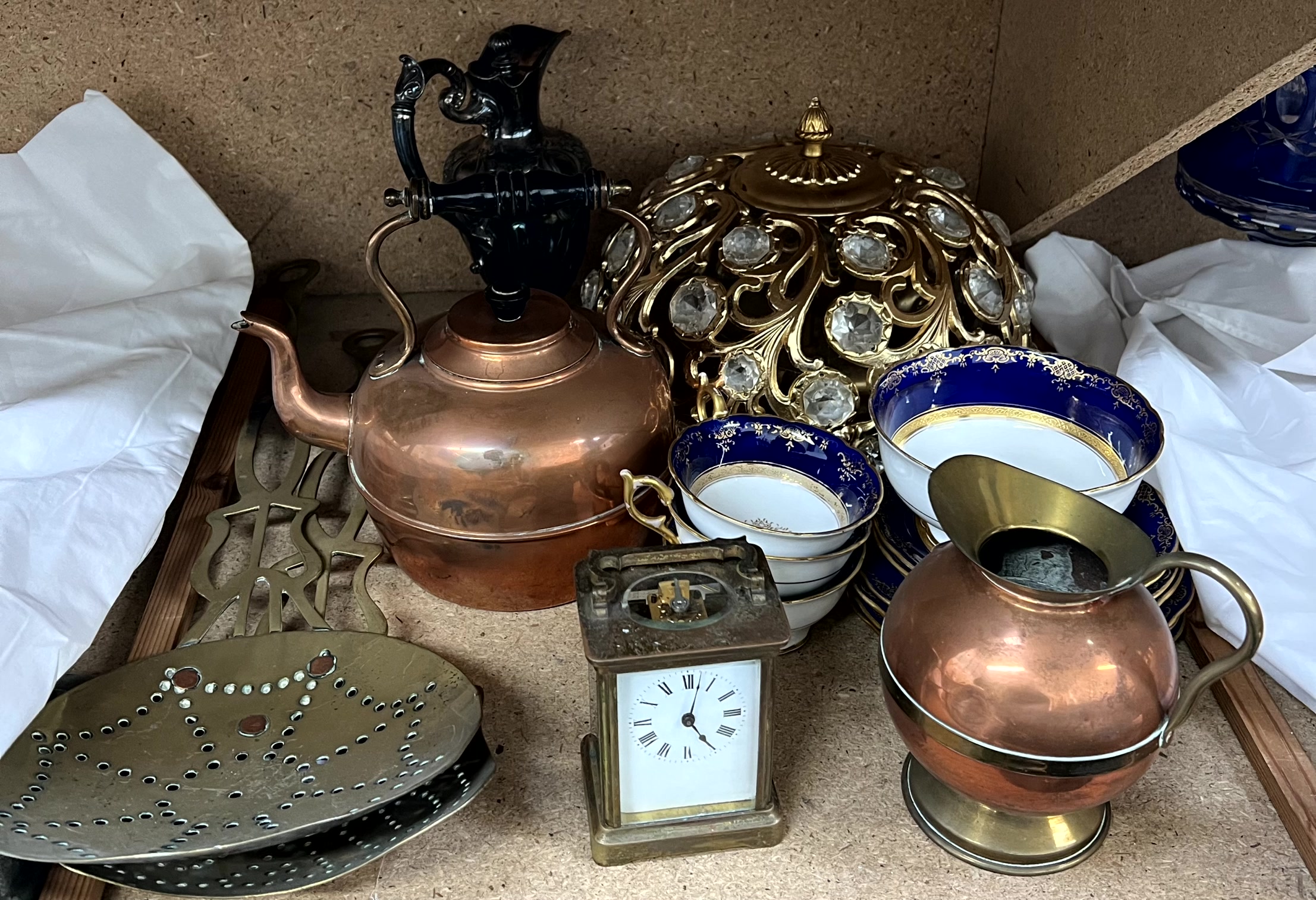 A brass cased carriage clock together with a copper kettle, brass chestnut pans,